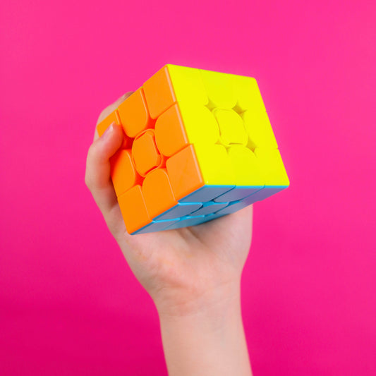 Person holding cube in their hand